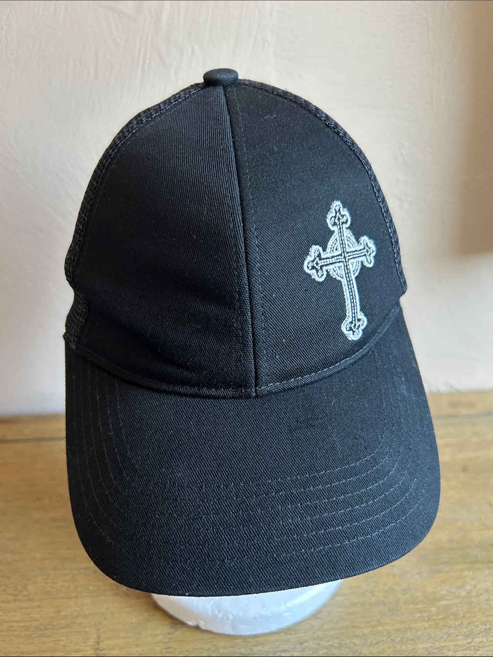 Port Authority Black Trucker Hat With White Embroidered Cross. 100% Cotton Unise